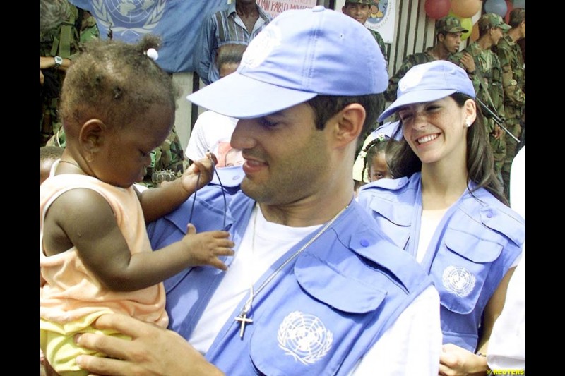 Juan Pablo Montoya during a visit at the impoverished village of Napipi, in northwestern Choco Province, November 22, 2002. Choco is one of Colombia's poorest regions and is hard hit by a 38-year old guerrilla war that kills thousands of people every year. Montoya is visiting Napipi as part of a campaign to donate money to poor children.