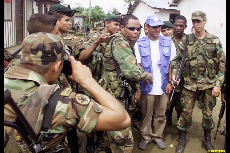 Juan Pablo Montoya during a visit at the impoverished village of Napipi, in northwestern Choco Province, November 22, 2002. Choco is one of Colombia's poorest regions and is hard hit by a 38-year old guerrilla war that kills thousands of people every year. Montoya is visiting Napipi as part of a campaign to donate money to poor children.