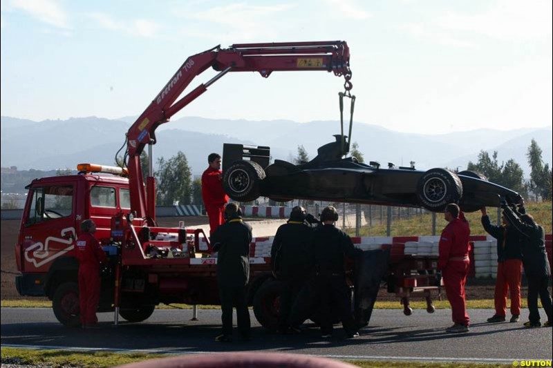 Giancarlo Fisichella's Jordan is towed back to the pits after a mechnical failure. Barcelona, Spain. January 20th 2003.