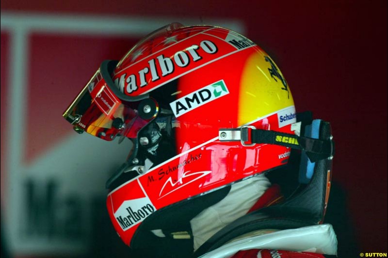 Michael Schumacher tries the HANS device at the Circuit de Catalunya. Barcelona, Spain. February 3rd, 2003.