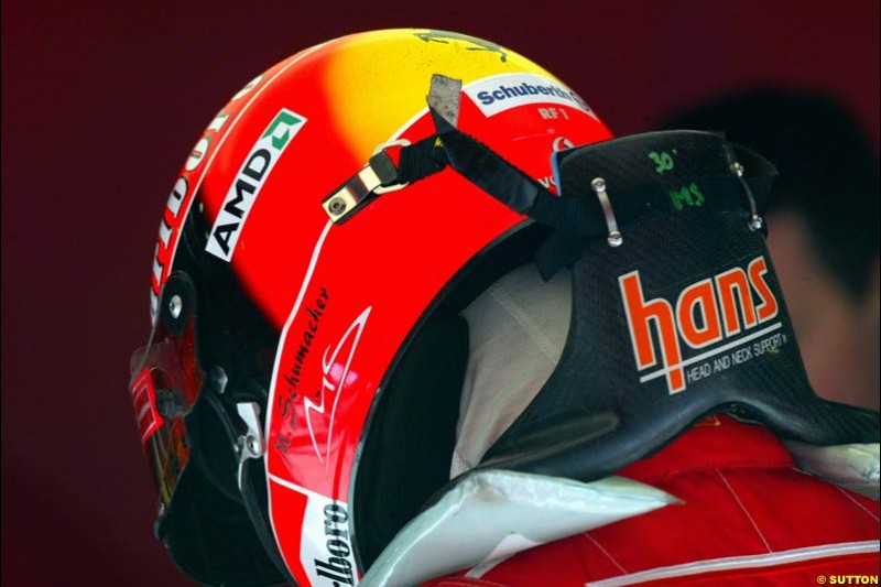Michael Schumacher tries the HANS device at the Circuit de Catalunya. Barcelona, Spain. February 3rd, 2003.