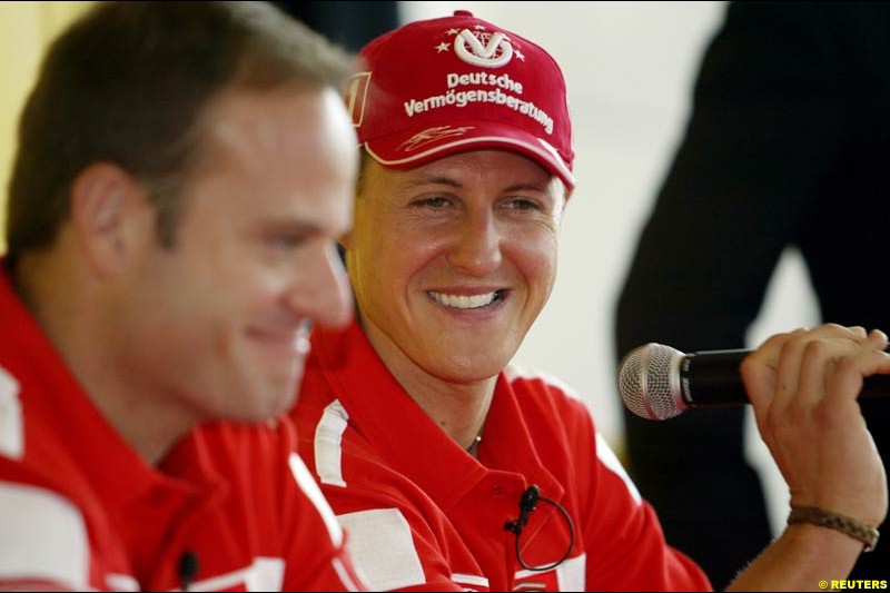 Ferrari's Rubens Barrichello and Michael Schumacher attend a press conference in Melbourne, Australia. March 6th 2003.