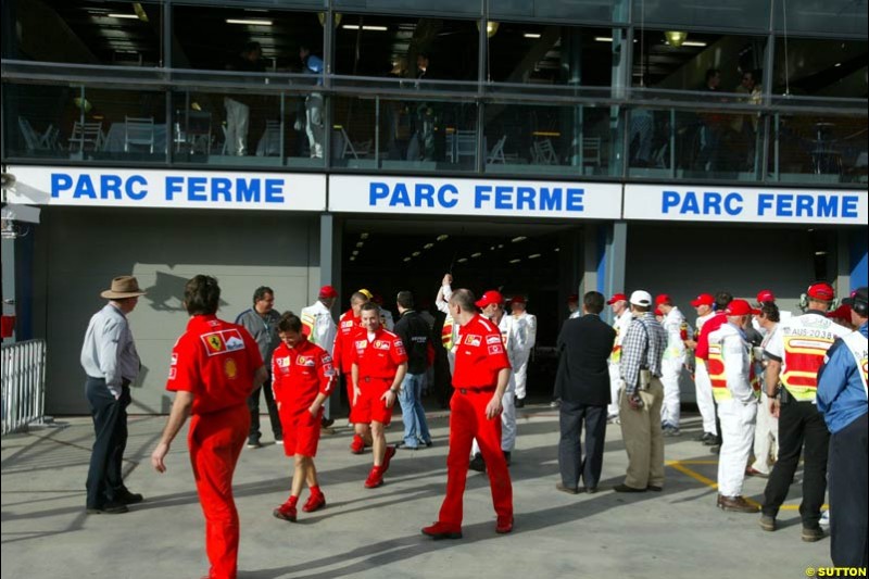 Mechanics leave Parc Ferme. Saturday, Australian GP, March 8th 2003.
