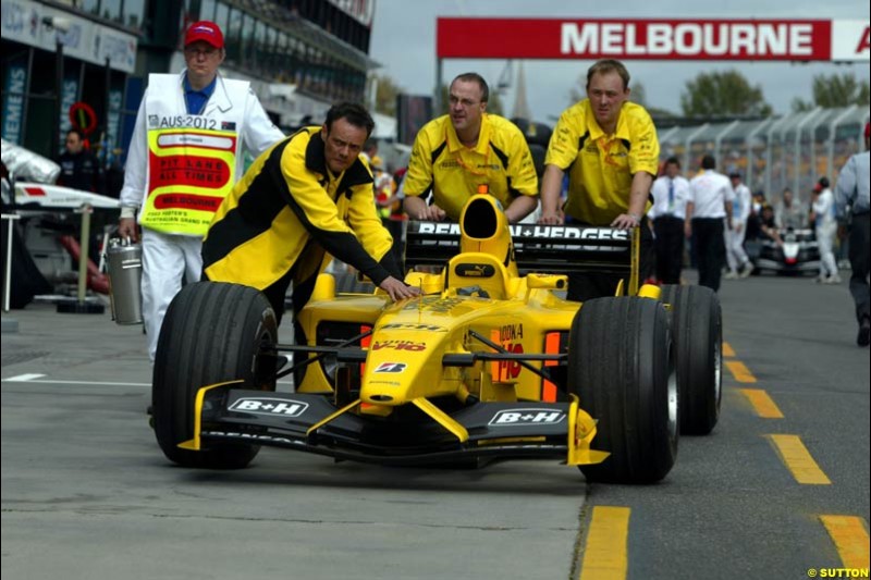 The Jordan team bring the car back to the garage under the supervision of the scrutineer after qualifying for the Australian GP. Melbourne, March 8th 2003.
