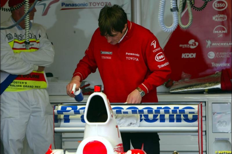 The Toyota mechanic works on the car in Parc Ferme after qualifying for the Australian GP. Melbourne, March 8th 2003.