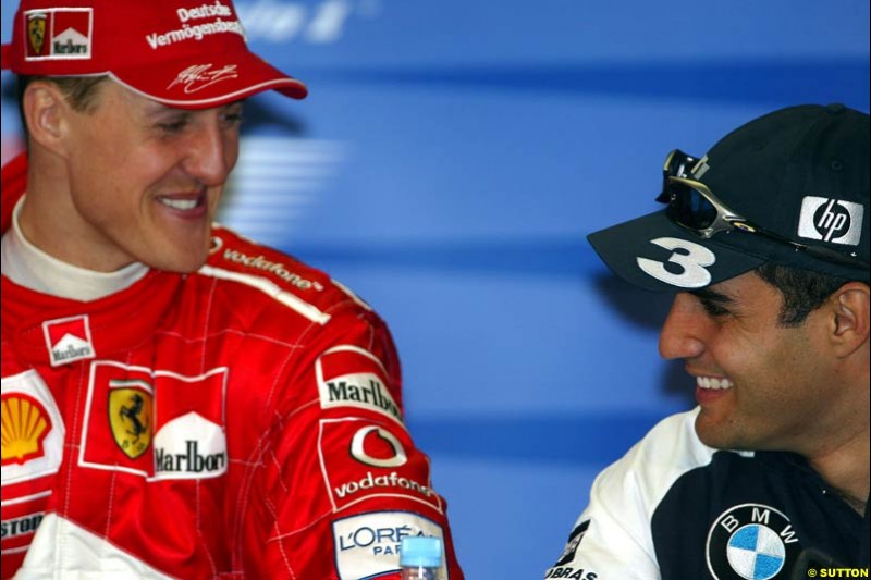 Michael Schumacher, Ferrari, and Juan Pablo Montoya, Williams, at the post-qualifying press conference after Saturday's qualifying for the Australian GP. Melbourne, March 8th, 2003.