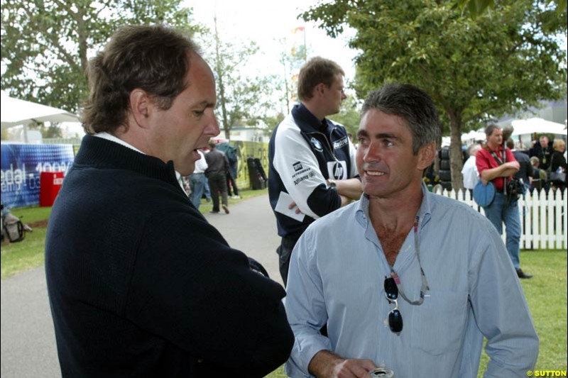 BMW's Gerhard Berger talks to World Champion Mick Doohan at the paddock during Saturday's qualifying for the Australian GP. Melbourne, March 8th, 2003.
