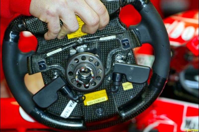 Ferrari working on Michael Schumacher's damaged car. Saturday practice. Australian GP, Melbourne. March 8th 2003.
