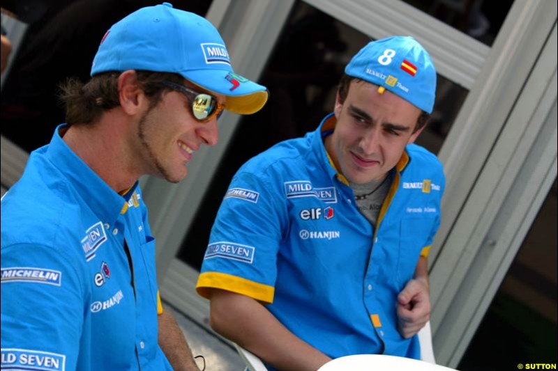 Jarno Trulli and teammate Fernando Alonso, Renault, after Friday qualifying for the Malaysian GP. Sepang, March 21st 2003.