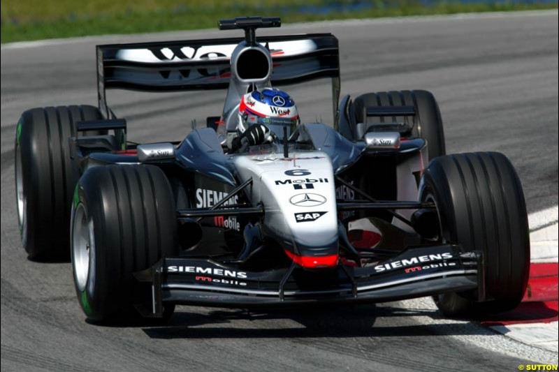 Kimi Raikkonen, McLaren. Friday qualifying for the Malaysian GP. Sepang International Circuit, March 21st 2003.