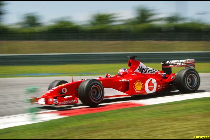 Rubens Barrichello, Ferrari, during Friday free practice at Sepang International Circuit. Malaysian GP, March 21st 2003.