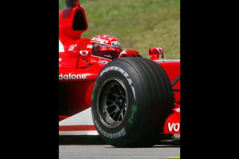 Michael Schumacher, Ferrari, during Friday practice session at Sepang International Circuit. Malaysian GP, March 21st 2003.