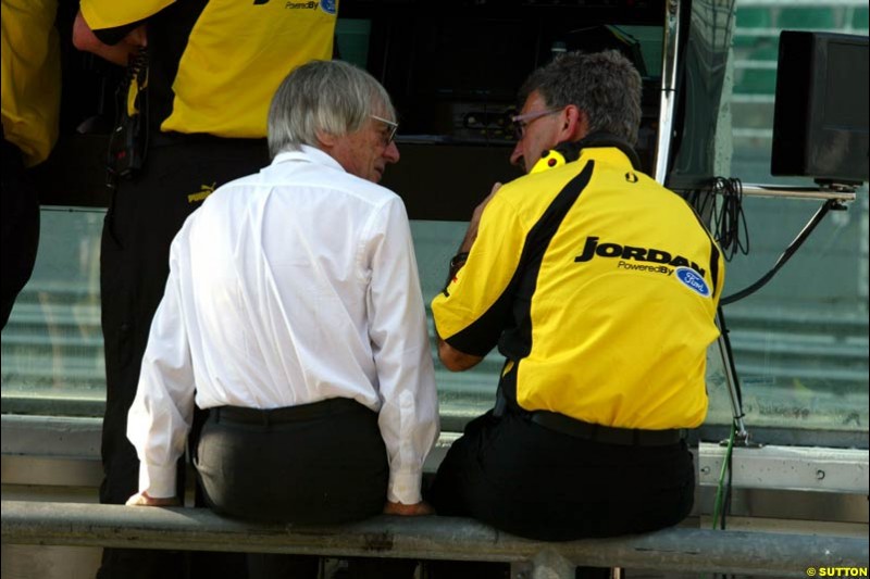 Bernie Ecclestone talks to Eddie Jordan during Friday morning testing at Sepang International Circuit. Malaysian GP, March 21st 2003.