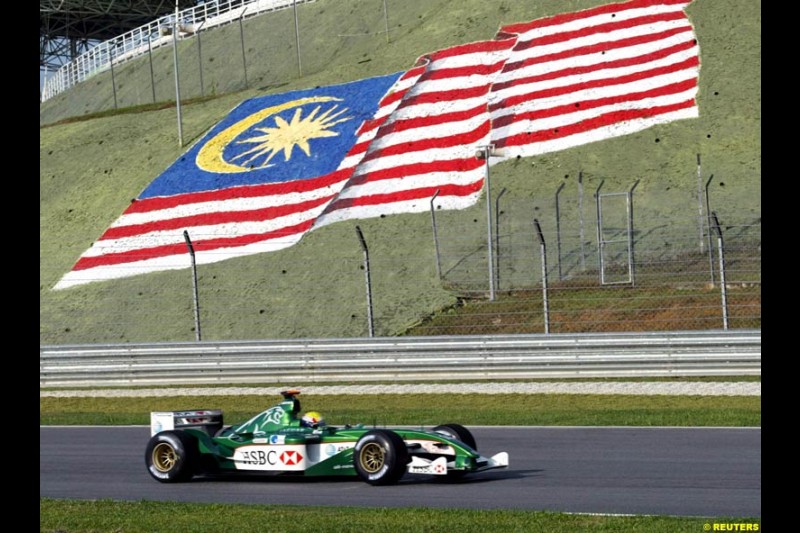 Mark Webber, Jaguar, during Friday morning testing at Sepang International Circuit. Malaysian GP, March 21st 2003.