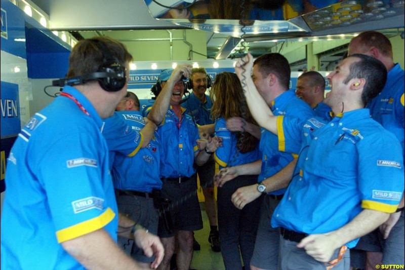 Renault team celebrates their all front row after Saturday qualifying for the Malaysian GP. Sepang, March 22nd 2003.