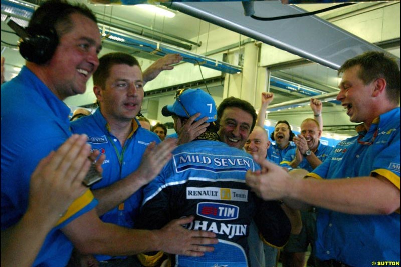 Renault team celebrates their all front row after Saturday qualifying for the Malaysian GP. Sepang, March 22nd 2003.