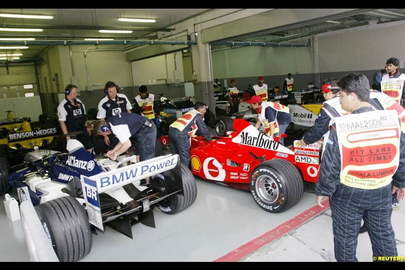 Cars taken to parc ferme after Saturday qualifying for the Malaysian GP. Sepang, March 22nd 2003.