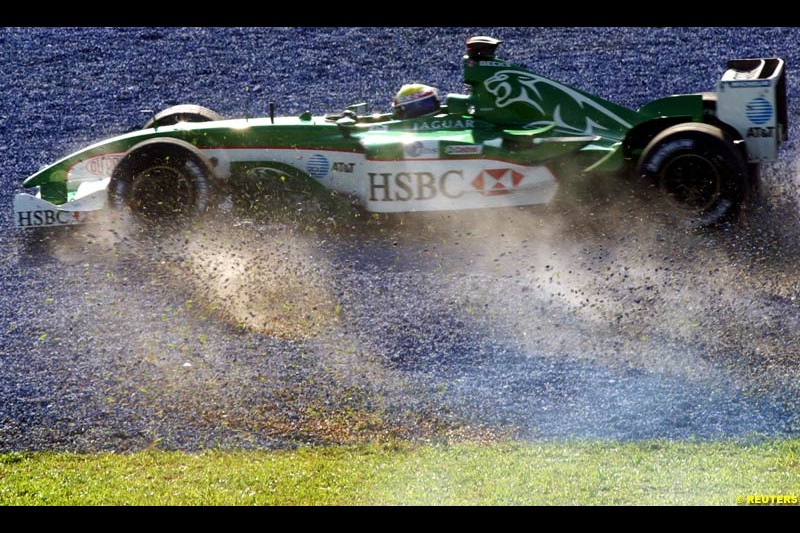 Mark Webber, Jaguar, spins during Saturday practice for the Malaysian GP. Sepang, March 22nd 2003.