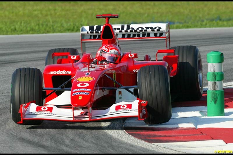 Michael Schumacher, Ferrari, during Saturday practice for the Malaysian GP. Sepang, March 22nd 2003.