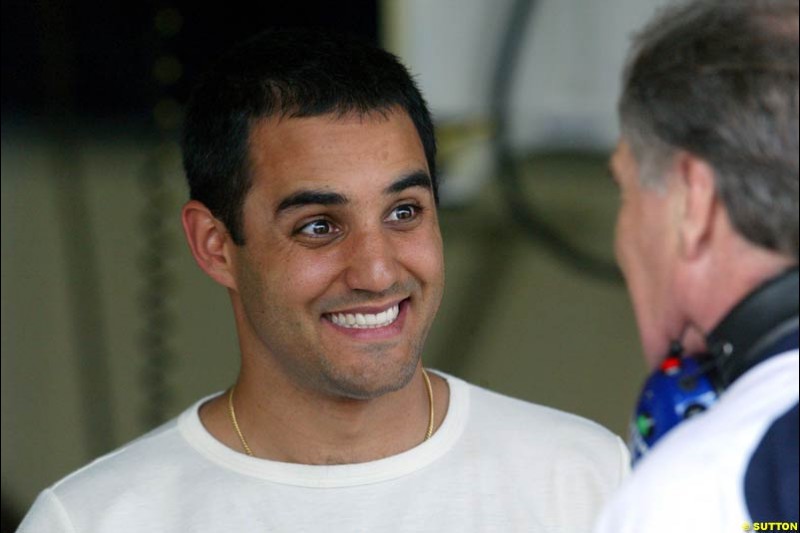 Juan Pablo Montoya puts a happy face for Patrick Head. Saturday qualifying for the Brazilian Grand Prix. Interlagos, Sao Paulo, April 5th 2003.