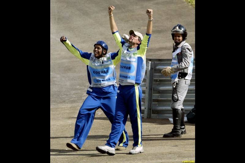 Brazilian track stewards thrilled with local boy Rubens Barrichello being on pole, after qualifying for the Brazilian Grand Prix. Interlagos, Sao Paulo, April 5th 2003.