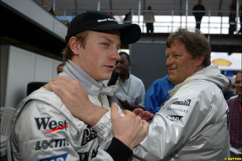 Norbert Haug congratulates Kimi Raikkonen, McLaren. Brazilian Grand Prix. Interlagos, Sao Paulo, April 6th 2003.
