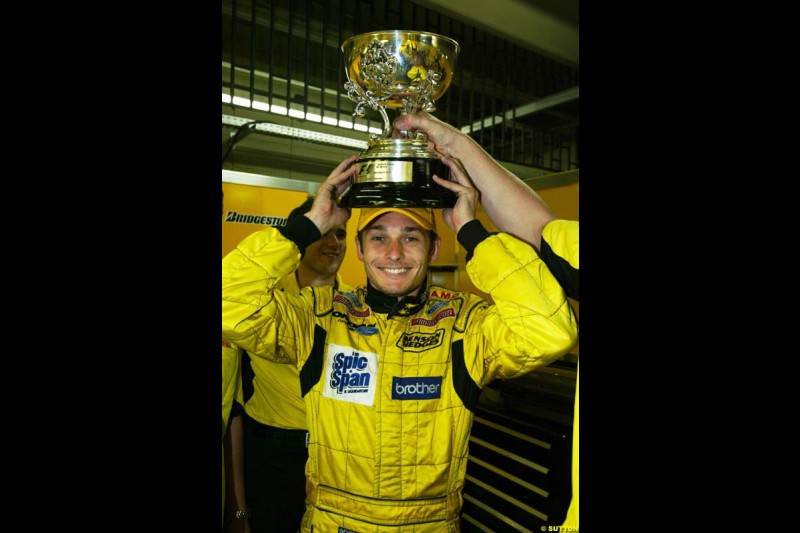 Giancarlo Fisichella, Jordan, celebrates second place. Brazilian Grand Prix. Interlagos, Sao Paulo, April 6th 2003.