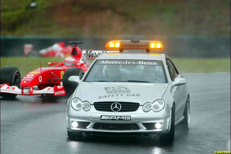 The pace car is followed by Rubens Barrichello, Ferrari. Brazilian Grand Prix. Interlagos, Sao Paulo, April 6th 2003.