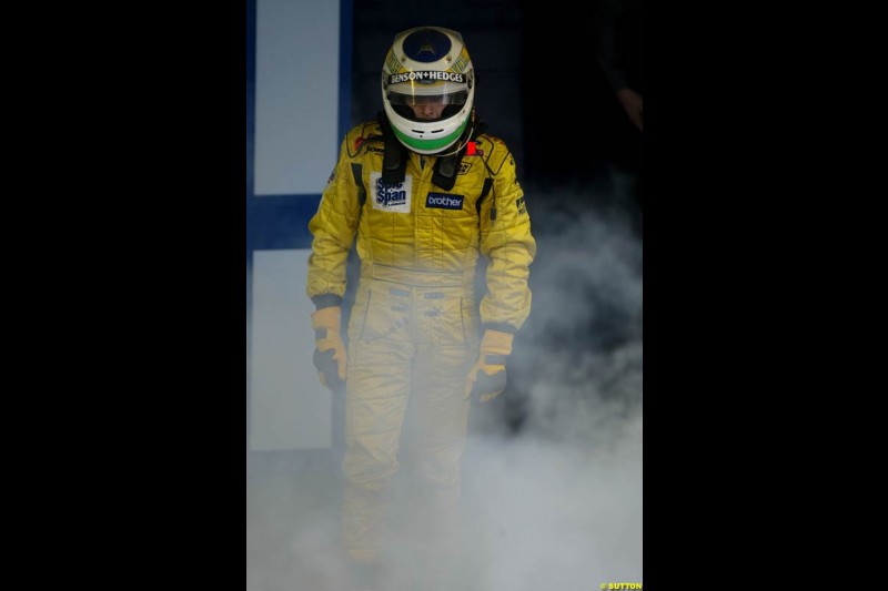 Giancarlo Fisichella, Jordan, looks on as his car suffers a small fire at the end of the race. Brazilian Grand Prix. Interlagos, Sao Paulo, April 6th 2003.