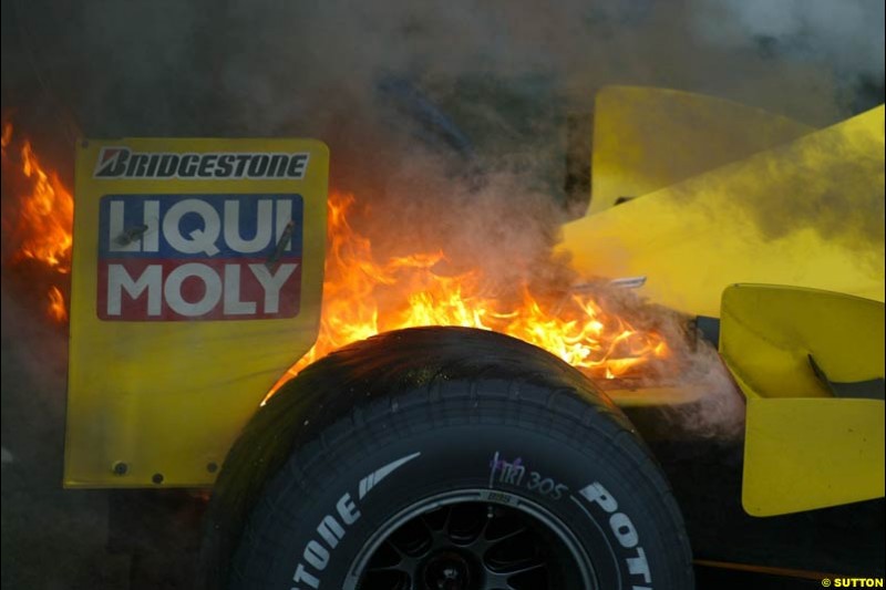 Giancarlo Fisichella's Jordan suffers a small fire at the end of the race. Brazilian Grand Prix. Interlagos, Sao Paulo, April 6th 2003.