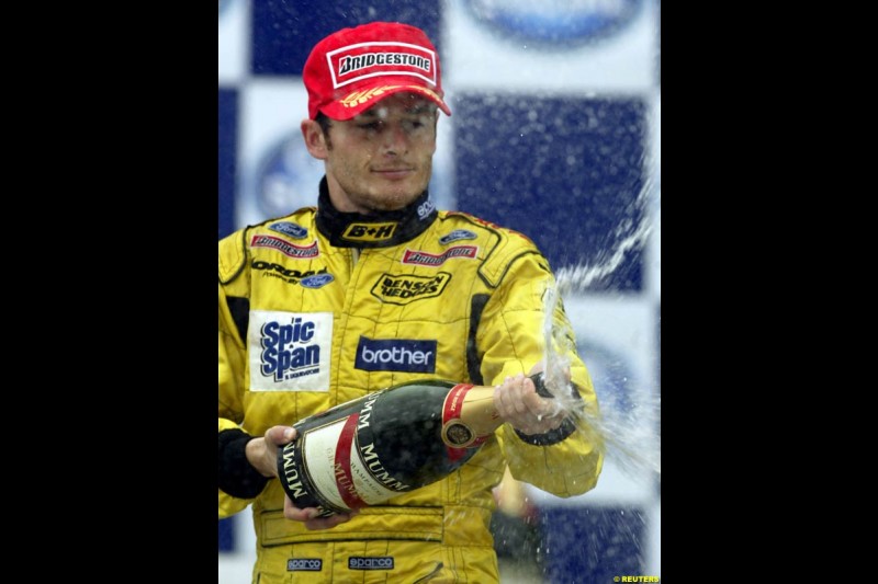 Giancarlo Fisichella, Jordan, celebrates second place. Brazilian Grand Prix. Interlagos, Sao Paulo, April 6th 2003.