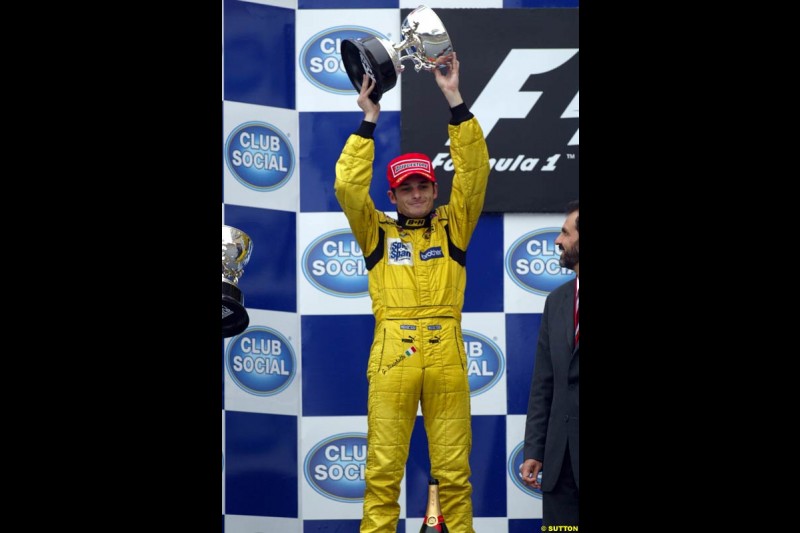 Giancarlo Fisichella, Jordan, celebrates second place. Brazilian Grand Prix. Interlagos, Sao Paulo, April 6th 2003.