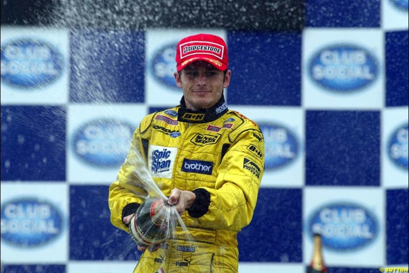 Giancarlo Fisichella, Jordan, celebrates second place. Brazilian Grand Prix. Interlagos, Sao Paulo, April 6th 2003.