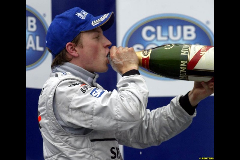 Kimi Raikkonen celebrates victory. Brazilian Grand Prix. Interlagos, Sao Paulo, April 6th 2003.