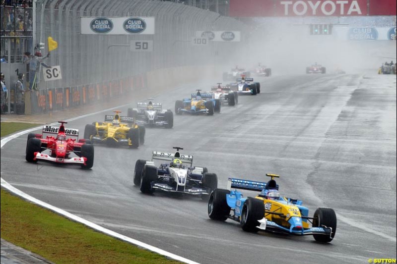 Jarno Trulli, Renault, leads the pack during a safety car period. Brazilian Grand Prix. Interlagos, Sao Paulo, April 6th 2003.