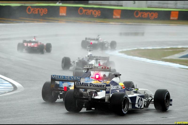 Jarno Trulli, Renault, passes Ralf Schumacher, Williams. Brazilian Grand Prix. Interlagos, Sao Paulo, April 6th 2003.