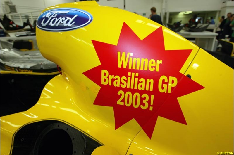 The Jordan team celebrate Giancarlo Fisichella's belated victory at the Brazilian Grand Prix. 11 April, 2003.