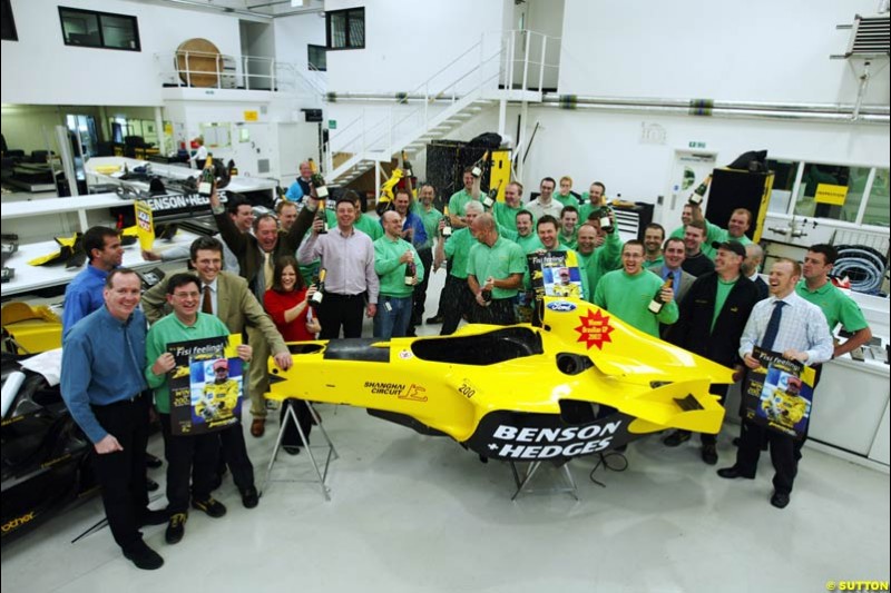 The Jordan team celebrate Giancarlo Fisichella's belated victory at the Brazilian Grand Prix. 11 April, 2003.