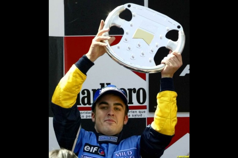 Fernando Alonso, Renault, celebrates second place. Spanish Grand Prix. Circuit de Catalunya, Barcelona, Spain. May 4th 2003.