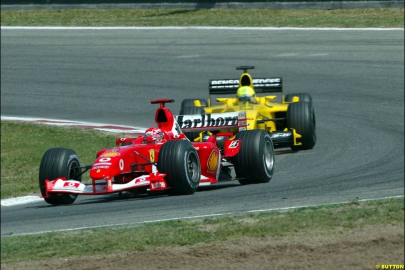 Michael Schumacher, Ferrari, laps Ralph Firman, Jordan. Spanish Grand Prix. Circuit de Catalunya, Barcelona, Spain. May 4th 2003.