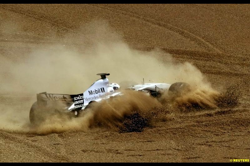 David Coulthard, McLaren, slides into the sand trap. Spanish Grand Prix. Circuit de Catalunya, Barcelona, Spain. May 4th 2003.