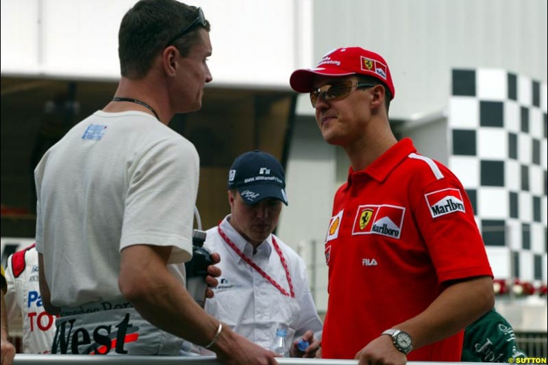 David Coulthard, McLaren, and Michael Schumacher, Sunday's Drivers' Parade at the Spanish Grand Prix. Circuit de Catalunya, Barcelona, Spain. May 4th 2003.