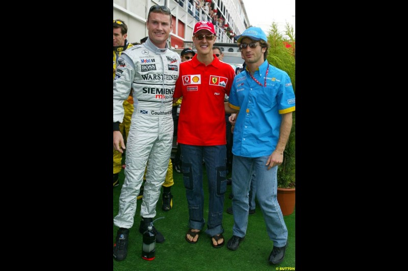 David Coulthard, McLaren, Michael Schumacher, Ferrari, and Jarno Trulli, Renault. Sunday's Drivers' Parade at the Spanish Grand Prix. Circuit de Catalunya, Barcelona, Spain. May 4th 2003.