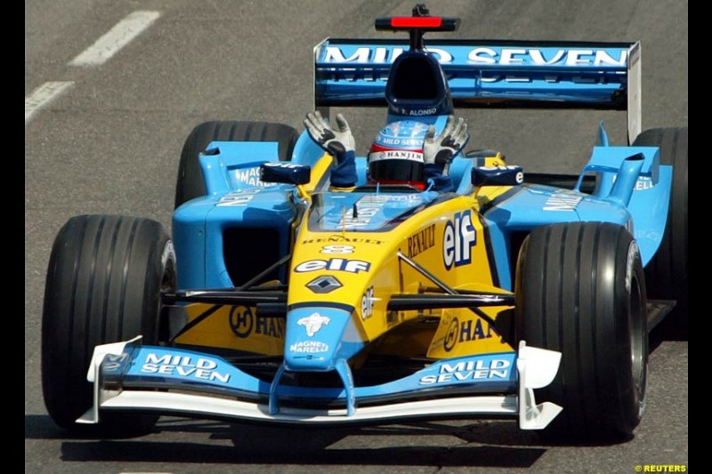 Renault's Fernando Alonso speeds down Madrid's central Paseo de la Castellana during an exhibition celebrating his success so far this season. May 11th 2003. 