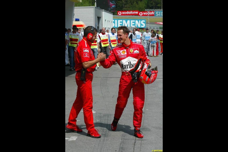 Michael Schumacher, Ferrari, celebrates pole position. Austrian Grand Prix. A1-Ring, Spielberg, Austria. May 17th 2003.