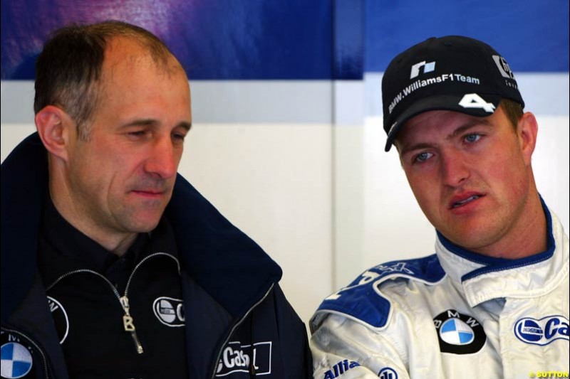 Ralf Schumacher, Williams, chats to a Williams engineer. Austrian Grand Prix. A1-Ring, Spielberg, Austria. May 17th 2003.  