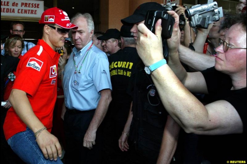 Michael Schumacher comes out of the press centre at Monte Carlo. Monaco Grand Prix, Wednesday, May 28th 2003.