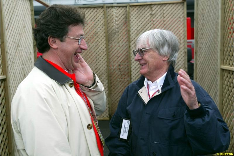 Bernie Ecclestone, F1 Supremo, chats to Louis Camilleri, Chairman of Philip Morris Group. Canadian Grand Prix, Montreal, Saturday, June 14th 2003.