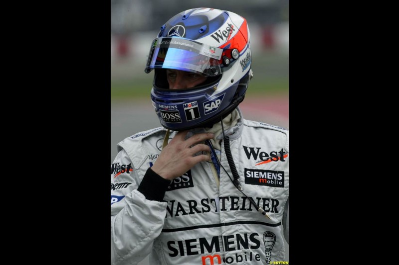 Kimi Raikkonen, McLaren, walks back to the pits after spinning during qualifying. Canadian Grand Prix, Montreal, Saturday, June 14th 2003.