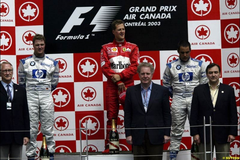 The Podium. 1st, Michael Schumacher, Ferrari; 2nd, Ralf Schumacher, Williams; 3rd, Juan Pablo Montoya, Williams. Canadian Grand Prix, Montreal, Sunday, June 15th 2003. 
